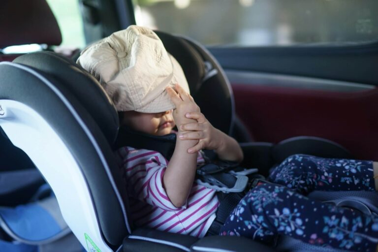 Baby with hat in car seat - Australian Standards
