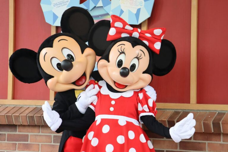 Mickey and Minnie dancing outside Disneyland close up