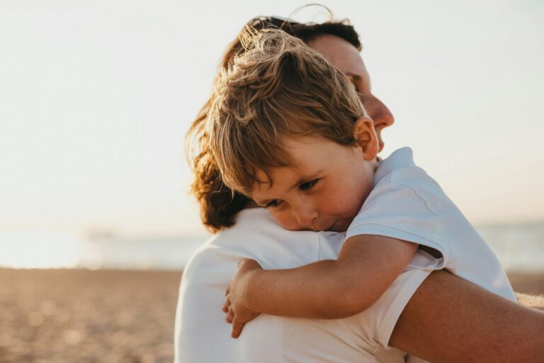 Mum cuddling overstimulated toddler