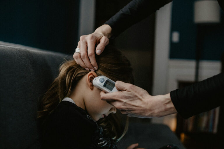 Digital Ear Thermometer testing and reading on child