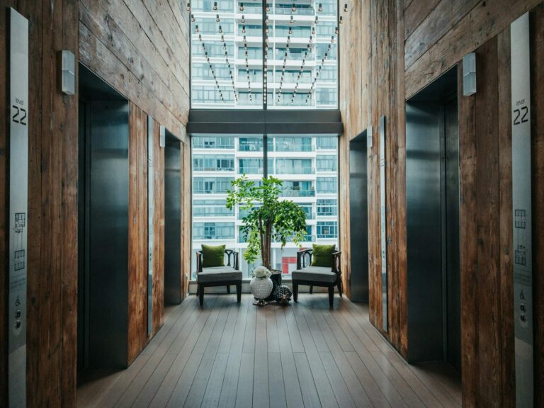 Hotel elevators in front of floor-to-ceiling windows