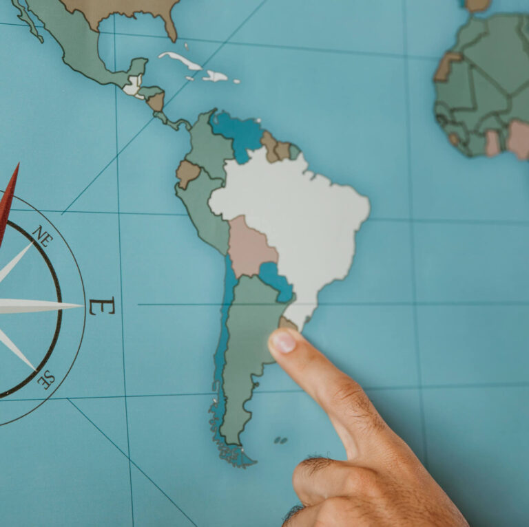 Family planning a South America trip from Australia with children on a map
