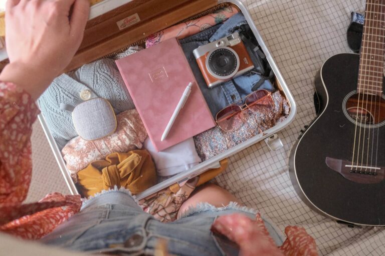 A suitcase fully packed with travel items for travel to South America with family
